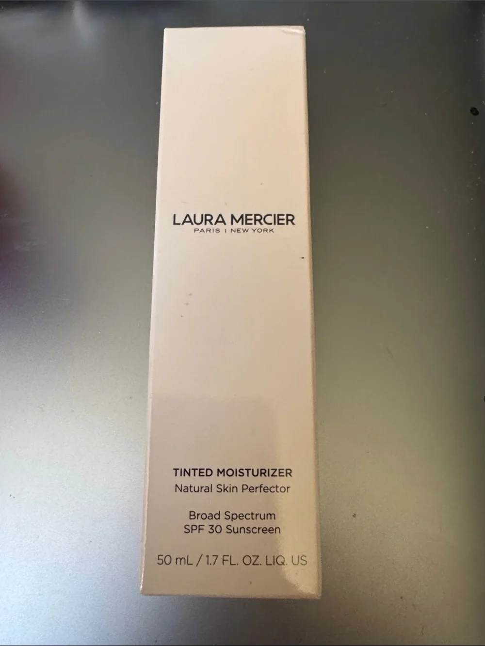 laura mercier Tinted Moisturizer in Light Beige Packaging